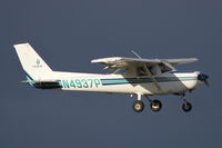 N4937P @ PAE - One of Regal Air's Cessna 152's landing with a mean black sky back ground - by Duncan Kirk