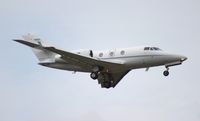 N715JC @ ORL - Falcon 10 arriving for NBAA as Hurricane Sandy passes off shore