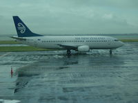 ZK-NGK @ NZAA - From a wet AKL airport - view from domestic baggage collection window. - by magnaman