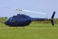 G-OCFD @ EGBT - being used for ferrying race fans to the British F1 Grand Prix at Silverstone - by Chris Hall