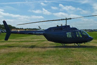 G-OCFD @ EGBT - being used for ferrying race fans to the British F1 Grand Prix at Silverstone - by Chris Hall