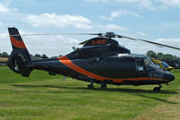 G-OLNT @ EGBT - being used for ferrying race fans to the British F1 Grand Prix at Silverstone - by Chris Hall