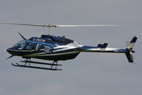 G-RCOM @ EGBT - being used for ferrying race fans to the British F1 Grand Prix at Silverstone - by Chris Hall