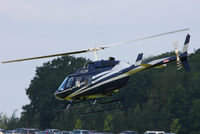 G-RCOM @ EGBT - being used for ferrying race fans to the British F1 Grand Prix at Silverstone - by Chris Hall