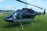 G-JACI @ EGBT - being used for ferrying race fans to the British F1 Grand Prix at Silverstone - by Chris Hall