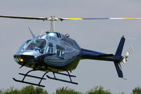 G-BXKL @ EGBT - being used for ferrying race fans to the British F1 Grand Prix at Silverstone - by Chris Hall