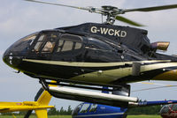 G-WCKD @ EGBT - being used for ferrying race fans to the British F1 Grand Prix at Silverstone - by Chris Hall