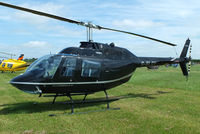 G-BLGV @ EGBT - being used for ferrying race fans to the British F1 Grand Prix at Silverstone - by Chris Hall