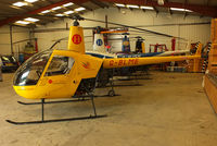 G-BLME @ EGBW - inside the Heliair hangar - by Chris Hall