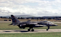 XX834 @ EGQS - Jaguar T.2 of 226 Operational Conversion Unit taxying to Runway 05 at RAF Lossiemouth in the Summer of 1981. - by Peter Nicholson