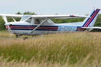 G-CSFC @ EGFH - Visiting Cessna 150. The grass is ready for a trim. - by Roger Winser