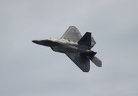 03-4042 - F/A-22A over Cocoa Beach - by Florida Metal