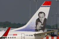 LN-DYM @ EGCC - Norwegian Air Shuttle Boeing 737 featuring André Bjerke (born 30 January 1918, died 10 January 1985) was a Norwegian writer and poet - by Chris Hall