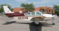 N4324W @ KAXN - Beech E-55 Baron at the fuel pumps. - by Kreg Anderson