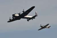 PA474 - Off airport. Five Merlins. BBMF Lancaster coded KC-A with little friend Hurricane IIc LF363 coded YB-W displaying on the first day of the Wales National Air Show, Swansea Bay, Wales, UK. - by Roger Winser