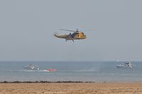 ZH540 - Off airport. SAR Sea King of 22 Squadron RAF exercising with the Mumbles Inshore RIB on the first day of the Wales National Air Show, Swansea Bay, UK. - by Roger Winser