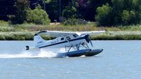 C-FHRT @ CYVR - Tofino Air landing on the Fraser River at YVR Seaplane Terminal. - by M.L. Jacobs