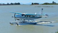 C-FJOE @ CYVR - Seair Seaplanes Cessna taxiing to the terminal on the Fraser River. - by M.L. Jacobs