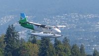 C-FWTE @ CYHC - Westcoast Air #603 passing over Stanley Park on approach to Coal Harbour landing. - by M.L. Jacobs