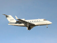 N340AK @ YYZ - 1999 Bombardier CL-600 landing on runway 24L at Toronto Int'l Aiport - by Ron Coates