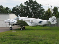 N7998K @ KBTV - This 1965 Beech H-19 sits tied down at the Burlington Vermont Int'l Airport - by Ron Coates