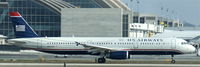 N559UW @ KLAX - US Airways, is departing Los Angeles Int´l(KLAX) via RWY 24L - by A. Gendorf
