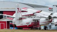 C-FEFK @ CYXX - Conair #74 fire-fighting tanker is out of service but still registered and sits beside the Conair Aviation hangar. - by M.L. Jacobs