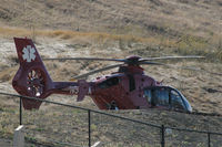 N30RX @ CN06 - on the helipad at Sonoma Speedway - by Bruce H. Solov