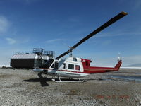 C-FMLT - At the beach tanks at Bernard Harbour, Nunavut, Canada (along the North West Passage), with arctic sea ice in the back ground - June 2013. C-FMLT was a former Japanese Coast Guard aircraft and had commenced the contract in white /baby blue paint scheme. - by T.B. Orlowski, BH12 Aircraft Captain