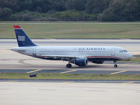 N113UW @ KTPA - This Airbus A320 just landed on rwy 36L at Tampa Int'l Airport - by Ron Coates