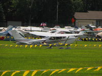 C-GUYA @ KOSH - Taxing in the grass at KOSH - by steveowen