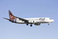 DQ-FJG @ YSSY - Fuji Airways (DQ-FJG) Boeing 737-8X2(WL) on approach to runway 25 at Sydney Airport. - by YSWG-photography