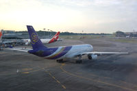 HS-TEO @ WSSS - Thai Airbus A330-300 taxying away from the terminal at Singapore Changi airport. - by Henk van Capelle