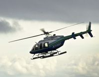 N199F @ EGFH - Visiting Bell 407 seen departing to the East. - by Derek Flewin