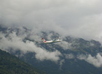 OE-LGD @ LOWI - take-off into a cloudy sky - by Thomas Ranner