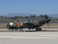 N749DP @ CMA - 1983 Vickers/Supermarine SPITFIRE Mk XIV, Rolls Royce Griffon 65 V-12 2.050 Hp, on flight line - by Doug Robertson