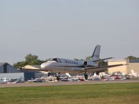 N725DS @ KOSH - Wheels off the ground and heading out of Oshkosh - by steveowen