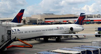 N925DL @ KATL - At the gate, air conditioning hoses in place, rear door open Atlanta - by Ronald Barker