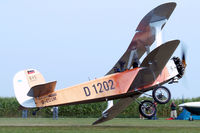 D-EOSM @ EDMT - Udet U.12a Flamingo (replica) [1785] (Flugwerft Schleissheim) Tannheim~D 24/08/2013. Port wing starts to dip. - by Ray Barber