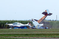 D-EOSM @ EDMT - Udet U.12a Flamingo (replica) [1785] (Flugwerft Schleissheim) Tannheim~D 24/08/2013. Just about coming to rest chap on the ground trying to raise himself up while it looks like the possible pilot of D-KKCN inspects the damage to his aircraft. - by Ray Barber