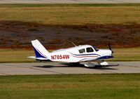 N7054W @ KGFK - Piper PA-28-180 Cherokee taxiing to runway 17L for departure. - by Kreg Anderson