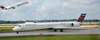 N933DN @ KATL - Taxi Atlanta with N929DL Departing in the background - by Ronald Barker