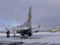 G-BTPC @ EGHH - On a snowy apron with Titan 737 and Royal Omani Air Force C130...not used to snow! - by John Coates