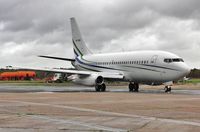 VP-CAQ @ EGHH - Taxiing for departure in rain. - by John Coates