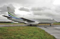 VP-CAQ @ EGHH - Taxiing to depart to Luton in the rain - by John Coates