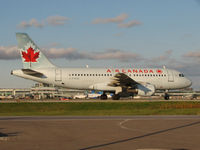 C-FYKW @ CYYZ - This 1997 Airbus 319 is taxiing to terminal after landing at Toronto Int'l Airport - by Ron Coates
