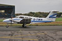 G-TWIN @ EGHH - Taxiing past Airtime North - by John Coates