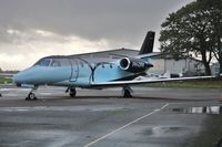 PH-DRK @ EGHH - At Signatures on a dark wet day - by John Coates