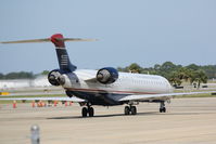 N904FJ @ KSRQ - US Air 2884 operated by Mesa (N904FJ) prepares for flight at Sarasota-Bradenton International Airport - by Donten Photography