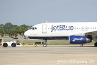 N665JB @ KSRQ - JetBlue Flight 164 (N665JB) Something About Blue prepares for flight at Sarasota-Bradenton International Airport - by Donten Photography